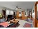 Spacious living room featuring a ceiling fan, natural lighting, and wood paneled walls at 945 Blackwell Rd, Marietta, GA 30066