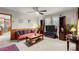 Comfortable living room featuring a ceiling fan, wood-paneled walls, and neutral carpet at 945 Blackwell Rd, Marietta, GA 30066