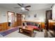 Comfortable living room featuring wood-paneled walls, neutral carpet, and natural lighting at 945 Blackwell Rd, Marietta, GA 30066