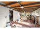 Cozy sunroom featuring rustic decor, brick accent walls and view to yard at 945 Blackwell Rd, Marietta, GA 30066