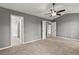 This bedroom features neutral carpet and paint, as well as an attached bathroom at 4248 Brighton Nw Way, Kennesaw, GA 30144