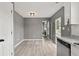 Open-concept dining area with hardwood floors, neutral paint, and access to the outdoor patio at 4248 Brighton Nw Way, Kennesaw, GA 30144