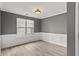 Dining room features wainscoting and a window providing natural light, creating a welcoming space at 4248 Brighton Nw Way, Kennesaw, GA 30144