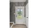 Bright entryway with decorative glass door and light wood-look flooring at 4248 Brighton Nw Way, Kennesaw, GA 30144