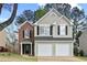 Charming two-story home featuring a brick accent, two-car garage, and a well-maintained front yard at 4248 Brighton Nw Way, Kennesaw, GA 30144