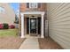Charming front entrance featuring a black door with decorative glass and white columns at 4248 Brighton Nw Way, Kennesaw, GA 30144