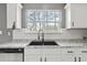 Kitchen with granite countertops, stainless steel appliances, modern fixtures and view from window at 4248 Brighton Nw Way, Kennesaw, GA 30144