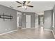 Open living room features light wood-look flooring with white trim and contemporary lighting at 4248 Brighton Nw Way, Kennesaw, GA 30144