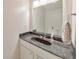 Bathroom features a modern sink and mirror, as well as updated fixtures and decorative towel rack at 664 Powers Ferry North Se, Marietta, GA 30067
