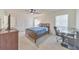 Bedroom featuring a ceiling fan, closet, and desk at 664 Powers Ferry North Se, Marietta, GA 30067
