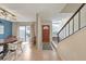 Open dining room with a view of the staircase and an entrance to the front door at 664 Powers Ferry North Se, Marietta, GA 30067