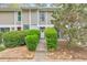 Charming townhouse exterior with neatly trimmed shrubs and a welcoming front entrance at 664 Powers Ferry North Se, Marietta, GA 30067