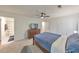 Spacious bedroom with ceiling fan, closet, and access to an ensuite bathroom at 664 Powers Ferry North Se, Marietta, GA 30067
