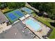 Birds eye view of tennis courts and an outdoor pool at a recreational facility at 8166 N Pine Cone Dr, Villa Rica, GA 30180