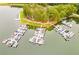A picturesque aerial view showcases an organized boat marina, surrounded by lush greenery, highlighting waterfront recreational opportunities at 8166 N Pine Cone Dr, Villa Rica, GA 30180