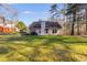 The house features a well-maintained lawn and a charming patio area at 8166 N Pine Cone Dr, Villa Rica, GA 30180