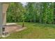 Spacious backyard with patio and lush greenery at 8166 N Pine Cone Dr, Villa Rica, GA 30180
