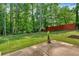 View of a lovely backyard and mature trees at 8166 N Pine Cone Dr, Villa Rica, GA 30180