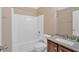 Well-lit bathroom with granite counters, shower and tub combination at 8166 N Pine Cone Dr, Villa Rica, GA 30180