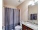 Bathroom with shower, toilet, vanity and sink, decorated with gray tones at 8166 N Pine Cone Dr, Villa Rica, GA 30180