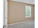 Bright bedroom with neutral walls, plush carpeting, and a large window providing ample natural light at 8166 N Pine Cone Dr, Villa Rica, GA 30180