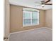 Bright bedroom with ceiling fan, window and neutral walls at 8166 N Pine Cone Dr, Villa Rica, GA 30180
