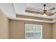 A bedroom with a ceiling fan, a window, neutral paint, and carpet flooring at 8166 N Pine Cone Dr, Villa Rica, GA 30180