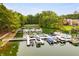 Extensive boat docks on the lake surrounded by lush greenery and upscale residences at 8166 N Pine Cone Dr, Villa Rica, GA 30180