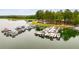 A high-angle view of an elaborate boat dock showcasing numerous boats of different sizes and colors at 8166 N Pine Cone Dr, Villa Rica, GA 30180