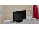 Walk-in closet with a TV, shelves and carpeted floor at 8166 N Pine Cone Dr, Villa Rica, GA 30180