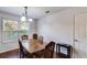 Traditional dining room with hardwood floors, chandelier, and elegant table at 8166 N Pine Cone Dr, Villa Rica, GA 30180