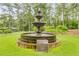 Scenic tiered water fountain set amidst lush greenery in a serene community park at 8166 N Pine Cone Dr, Villa Rica, GA 30180
