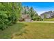 Charming single-Gathering home with a brick facade, attached garage, and spacious front yard at 8166 N Pine Cone Dr, Villa Rica, GA 30180