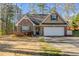 Charming brick home with a well-maintained front yard and attached two-car garage at 8166 N Pine Cone Dr, Villa Rica, GA 30180