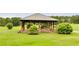Picturesque gazebo offering a shaded spot to relax and enjoy the community's green space at 8166 N Pine Cone Dr, Villa Rica, GA 30180
