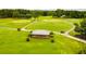 Aerial shot of a covered gazebo on a well-maintained golf course and green fairways at 8166 N Pine Cone Dr, Villa Rica, GA 30180