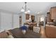 Kitchen with a breakfast bar featuring stainless appliances, dark wood cabinetry, and granite countertops at 8166 N Pine Cone Dr, Villa Rica, GA 30180