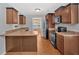 A kitchen with stainless steel appliances, granite counters, dark cabinets, and a dining area at 8166 N Pine Cone Dr, Villa Rica, GA 30180