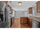 Kitchen with stainless steel appliances, hardwood floors, and dark cabinetry at 8166 N Pine Cone Dr, Villa Rica, GA 30180