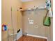 A laundry room with shelving and connections for a washer and dryer at 8166 N Pine Cone Dr, Villa Rica, GA 30180
