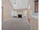 Large living room with fireplace and view to kitchen at 8166 N Pine Cone Dr, Villa Rica, GA 30180