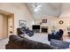 Spacious living room with vaulted ceiling, fireplace, and comfortable seating arrangement at 8166 N Pine Cone Dr, Villa Rica, GA 30180