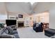 Spacious living room with vaulted ceiling, fireplace, and access to the backyard at 8166 N Pine Cone Dr, Villa Rica, GA 30180