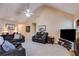 Comfortable living room with fireplace, neutral carpet, and cozy seating arrangement at 8166 N Pine Cone Dr, Villa Rica, GA 30180