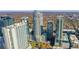 Stunning aerial view of luxurious high-rise buildings with a beautiful autumn treeline in the background at 855 Peachtree Ne St # 2812, Atlanta, GA 30308