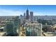 Expansive aerial view of the city skyline featuring modern high-rise buildings and colorful autumn trees at 855 Peachtree Ne St # 2812, Atlanta, GA 30308