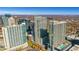 Impressive aerial view of high-rise apartments with city views, autumn trees, and private outdoor pools at 855 Peachtree Ne St # 2812, Atlanta, GA 30308