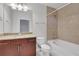Bathroom with granite countertop vanity, toilet, and tiled shower and tub at 855 Peachtree Ne St # 2812, Atlanta, GA 30308