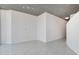 Empty bedroom featuring light gray walls, tiled floors and concrete ceilings at 855 Peachtree Ne St # 2812, Atlanta, GA 30308