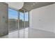 Bright bedroom featuring floor-to-ceiling windows and tiled floors that bring a touch of modern elegance to the space at 855 Peachtree Ne St # 2812, Atlanta, GA 30308